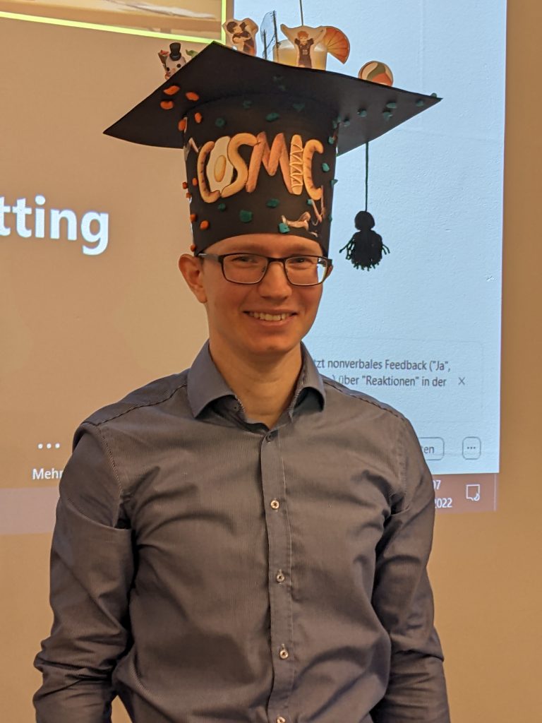 Martin wearing his personalized traditional PhD hat.